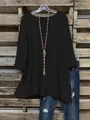 Detailweergave van de onregelmatige gelaagde zoom en 3/4 mouwen op deze zwarte top - 1XL / Tops / Zwart