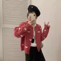 Cardigan in maglia rossa alla moda con motivo a cuore bianco e chiusura lampo centrale - Taglia unica / Top / Rosso