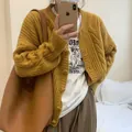 Oversized mustard yellow cable-knit cardigan sweater for women in retro design - One Size / Tops / Yellow