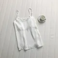 Close-up of elegant white satin camisole with adjustable thin straps - M / Tops / White