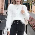 Stylish white fuzzy cable knit sweater featuring a plush texture and relaxed fit for women - Tops / White