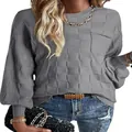 Detail view of grey women's knit sweater featuring unique block pattern texture and pocket - Gray