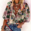 Detail of a stylish colorful floral print summer blouse with a button-up v-neck design - S / Tops / Red