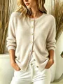 Close-up of soft beige knit cardigan with elegant gold button details and round neck - S / Tops / Off White