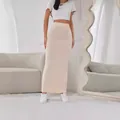 Elegant beige ribbed knit maxi skirt featuring an elastic high waist and French ins style - XS / Bottoms / Ivory