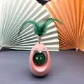 Pink tumbler cat toy with green feathers and integrated catnip ball - Cat Bell Tumbler (Pink) / 7x7x11cm
