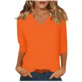 Detailed view of women's orange V-neck t-shirt showing comfortable fit and 3/4 sleeves - Orange