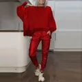 Casual women's red two-piece tracksuit with oversized side slit top and joggers. - Red