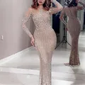 Close-up detail of an elegant gold sequin long evening dress with intricate embroidery - S / Dresses / Khaki Silver