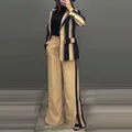 Elegant women striped two-piece suit set including blazer and wide-leg pants on model - S / Top And Bottom / Black & Khaki Striped