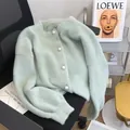 Soft mint green faux mink fur cardigan with pearl buttons for a cozy loose autumn style - One Size / Tops / Light Green