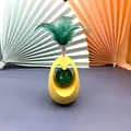 Interactive yellow egg cat tumbler toy with green feather and bell ball for pets - Cat Bell Tumbler (Yellow) / 7x7x11cm
