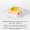 Yellow ceramic pet slow feeder bowl featuring a pink patterned slanted acrylic stand - Small Slow Feeder (Yellow) with Tilted Pink Stand