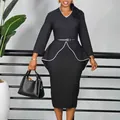 Full view of elegant black long sleeve dress with white piping and peplum detail - S / Black With Belt