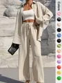 Detail of women's elegant beige two-piece set with long shirt and wide-leg trousers - S / Top And Bottom / Khaki