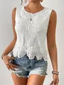Close-up detail of white sleeveless top featuring intricate floral lace hollow-out design. - S / Tops / White