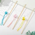 Set of 3 wooden cat teaser wands with colorful pom-poms and long tassels for active play. - Pom Pom Suede Strip