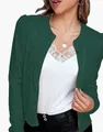 Close-up detail of a dark green sequined short jacket with an elegant stand collar. - S / Tops / Dark Green