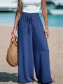 Detailed view of breathable blue wide-leg pants featuring a high waist drawstring design - 2XL / Bottoms / Dark Blue