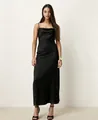 Full-length detail shot of an elegant black cowl neck satin slip dress on a model - S / Dresses / Black