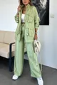 Detail view of textured green two-piece set featuring multi-pocket jacket and wide trousers - S / Top And Bottom / Green