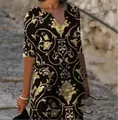 Detail of vintage baroque floral print V-neck dress with half sleeves on model - S / Dresses / Gold Baroque Print