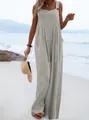 Casual sleeveless wide-leg jumpsuit in grey with button detail on a beach setting - S / Gray