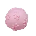 Durable pink TPR squeaky dog toy ball with raised paw print texture for pet teething - Macaron Pink Paw Ball