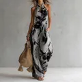 Elegant halter neck sleeveless jumpsuit featuring an abstract black and white print. - S / Graphite