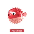 Pufferfish shaped dog treat dispenser toy made of durable TPR material in peach red - Red