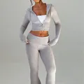 Two-piece grey knit set featuring a slim fit cropped zip-up hoodie and matching flare pants - S / Top And Bottom / Gray