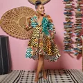 Vibrant leopard and floral print mini dress with a deep V-neck and stylish collar design. - Blue Leopard Print