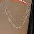 Close-up of elegant French style beaded fringe necklace with delicate hollow design - Silver-White