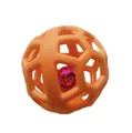 Detailed macro view of an orange TPR hollow pet ball with an internal glowing squeaker bell - About 9cm / Orange