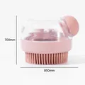 Pink silicone dog bath brush with transparent soap dispenser and soft massager bristles. - Pink