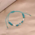 Hand-woven blue cord bracelet decorated with colorful beads and a central evil eye charm - Style 76-Sky Blue Rope Green Evil Eye (Style 76)