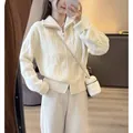 Elegante cárdigan blanco de punto de ochos con cremallera doble y ajuste holgado - Talla única / Tops / Blanco Roto