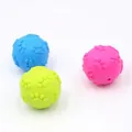 Macro view of three colorful durable dog chew toy balls with embossed paw prints - Paw Print Ball / 6cm