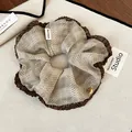 Close-up of retro polka dot scrunchie with handmade label and pleated brown edge - Scrunchie (Light Coffee) / Light Coffee