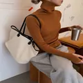 Slim fit orange ribbed turtleneck knit sweater for women with long sleeves and thumbholes - S / Tops / Caramel color