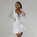 Detailed view of white rhinestone beaded long sleeve mini dress with ruffle hem - S / White