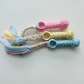Set mit drei bunten Kauspielzeugen für Hunde mit geflochtenen Baumwollseilen zur Zahnpflege - Fingerring mit Stoffstreifen / Zufällige Farbe