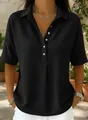 Détail d'un polo noir en maille gaufrée à manches courtes et boutons pour un look décontracté. - XS / Hauts / Noir