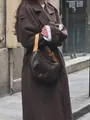 Stylish brown double-breasted long wool overcoat shown in a street fashion detail shot. - S / Tops / Dark Brown
