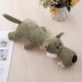 Durable green plush squeaky dog toy with textured corn kernel fabric for teeth cleaning. - Wolf