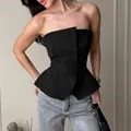 Elegant black strapless peplum corset top featuring a structured waist-cinching silhouette - S / Tops / Black