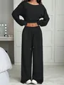 Detailed front view of women's black two-piece lounge set with cropped top and wide-leg pants - S / Top And Bottom / Black