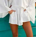 Close-up of white textured two-piece set with elastic waist shorts and pockets - S / Bottoms / White