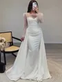 Elegant French satin mermaid wedding dress with sequin sleeves and a flowing train. - White