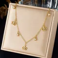 Elegant gold-plated stainless steel necklace featuring sparkling crown pendants and crystals - Pave Hollow Crown Multi Charm Necklace (N4598)